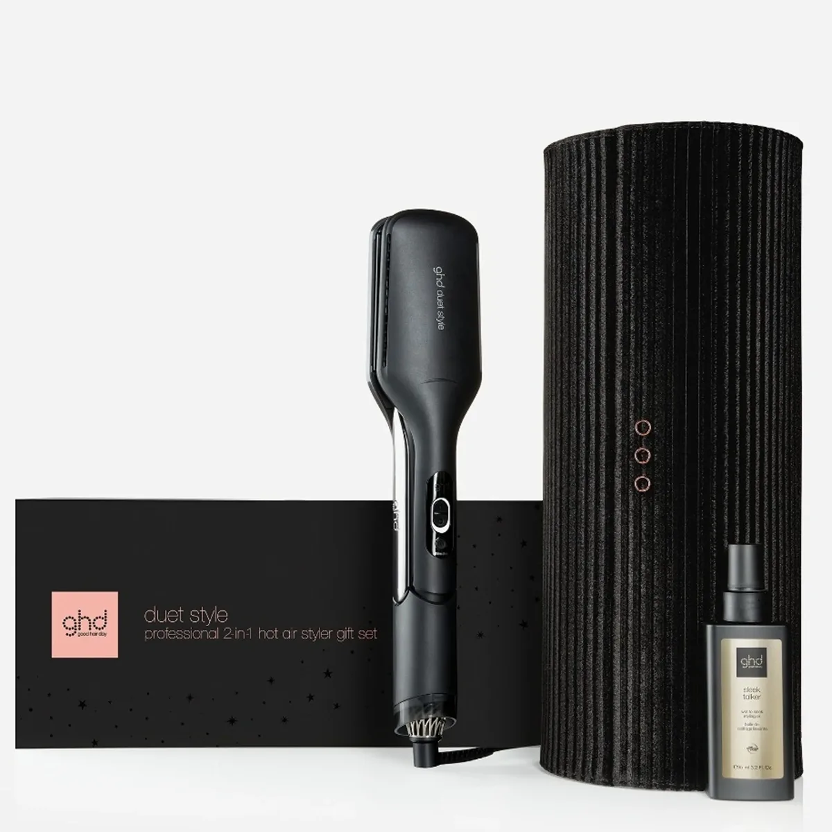 Das ghd Duet Style 2-in-1 Haartrockner und Glätteisen in Schwarz von ghd im Set mit hitzebeständigem Etui, Geschenkbox und einer Flasche Hitzeschutz-Arganöl.