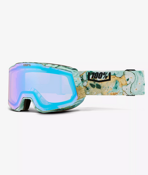 Die 100% Snowcraft Hiper Skibrille - beige hat einen marmorierten blau-hellbraunen Rahmen, blau getönte Gläser und Anti-Fog Technologie für klare Sicht auf der Piste.