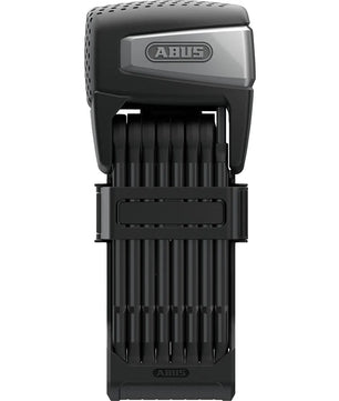 Das ABUS Bordo 6500A/110 Faltschloss - schwarz ist ein kompaktes, faltbares E-Bike-Schloss von ABUS, hier gefaltet mit einem strukturierten, rechteckigen Gehäuse auf der Oberseite.