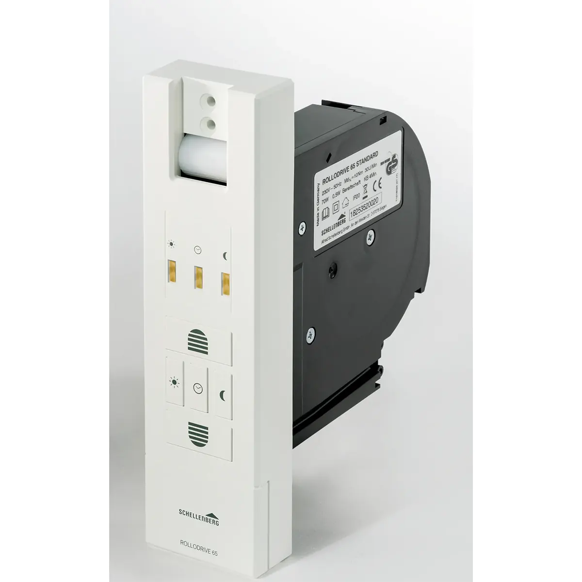 Der weiße Schellenberg RolloDrive 65 Gurtwickler besticht durch sein elegantes und modernes Design und wird zusammen mit seinem raffinierten schwarzen Mechanismus präsentiert – er bietet automatisierten Komfort für moderne Innenräume, ähnlich wie ein automatischer Lufterfrischer-Spender mit intuitiver Bedienung.