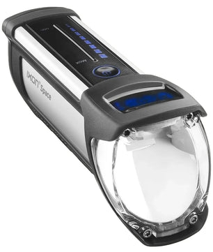 Schwarzer Busch & Müller IXON Space Dynamoscheinwerfer mit klarer Lichtscheibe, blauen Top-LED-Blinkern und hochwertiger Technik von Busch & Müller.