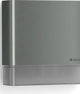 Der Steinel IS 180 digi Bewegungsmelder in Grau ist ein rechteckiger, an der Wand montierter Außenbewegungsmelder mit minimalistischem, modernem Design und dem Steinel-Logo unten rechts; ideal für den Außenbereich, ausgestattet mit einem digital einstellbaren Sensor und einem praktischen Bewegungsmelder.