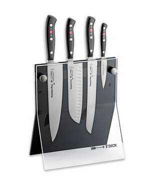 Auf einem transparenten Ständer mit Friedr.Dick-Branding werden vier Küchenmesser aufrecht stehend präsentiert, darunter der Friedr.Dick Premier Plus Messerblock 4 tlg - schwarz, ein vierteiliges Premium-Messer-Set mit hochwertigen geschmiedeten Klingen.