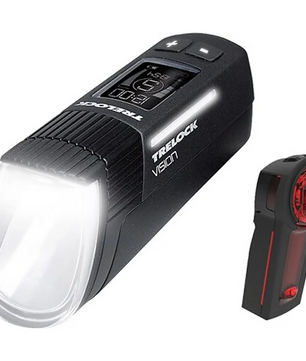Schwarzes TRELOCK LS 760 / LS 740 Vector Signal Vision Leucht-Set mit digitalem Display, StVZO-Zugelassen, weißer Frontleuchte und rotem Rücklicht.