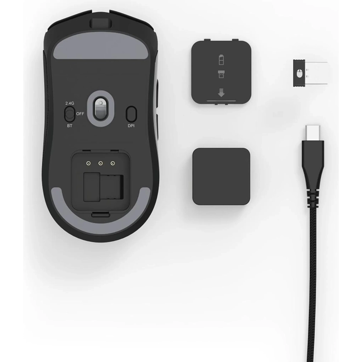 Die uRage Reaper 820 Gaming-Maus - Schwarz von uRage ist mit dem USB-Empfänger, dem Kabel und zwei kleinen Abdeckungen auf weißem Hintergrund abgebildet und verfügt über einen präzisen Pixart-Sensor für reibungsloses Gameplay.