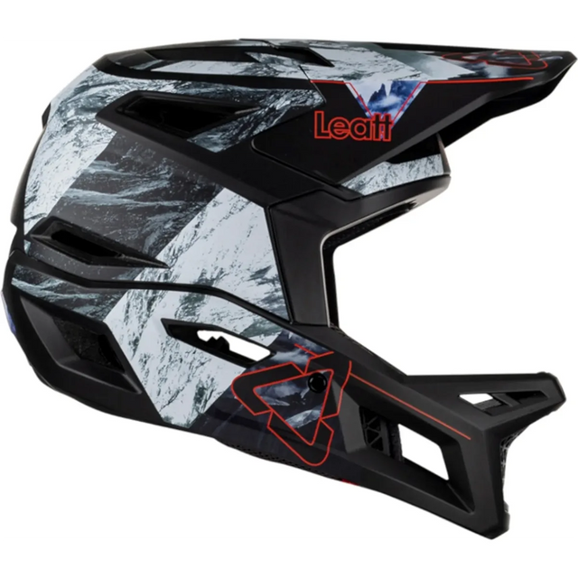 Der Leatt MTB Gravity 4.0 Helm in Größe L, schwarz, besticht durch sein kantiges Design, das rote Leatt-Logo an der Seite und die fortschrittliche 360° Turbine Technology für verbesserten Schutz.