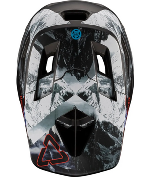 Der Leatt MTB Gravity 4.0 Helm in Schwarz (Größe L) verfügt über eine Berggrafik, Belüftungsöffnungen, 360° Turbine Technology und ein rotes Dreieckslogo - ideal für Enduro- oder Downhill-Abenteuer.