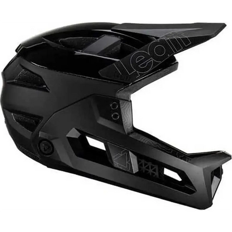 Der Leatt MTB Enduro 3.0 Stealth Helm in Größe S - schwarz bietet vielseitigen 3-in-1-Schutz für anspruchsvolle Trails, mit kantigen Belüftungsöffnungen und einem Visier; hier in der Seitenansicht.