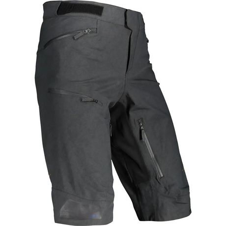 Die Leatt DBX 5.0 MTB Radhose in Größe S (schwarz) von Leatt verfügt über mehrere Reißverschlusstaschen und einen Klettbund für zuverlässigen Wetterschutz, hier auf weißem Grund.