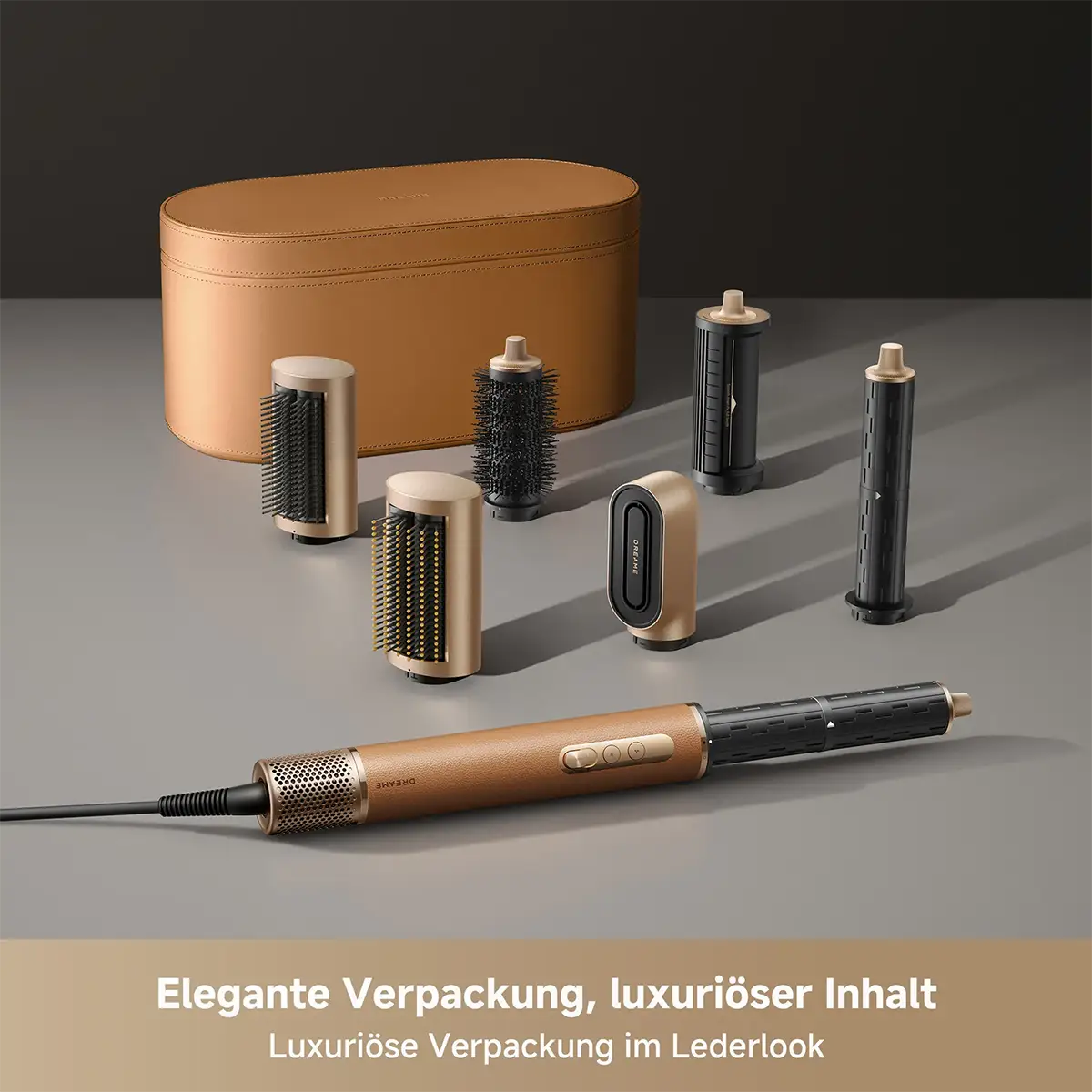 Das DREAME AirStyle Pro 7-in-1-Hairstyler-Set von DREAME mit mehreren Aufsätzen und passender Aufbewahrungstasche auf grauer Oberfläche.