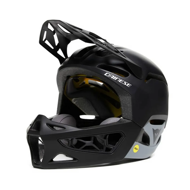 Der Dainese Linea 01 Fahrradhelm in Größe M/L, schwarz, ist ein Vollvisier-Helm mit Kinnschutz und Dainese-Logo - ideal für aggressives Downhill-Mountainbiking.