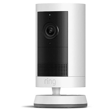 Die Ring Outdoor Cam Plus – Weiß ist eine kabellose Überwachungskamera auf einem Ständer, ausgestattet mit einer schwarzen Frontblende und einem Objektiv – die ideale Außenkamera von Ring mit leistungsstarkem Akku.