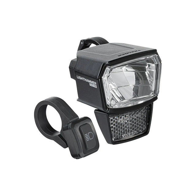 Der TRELOCK LS 940-HB Frontscheinwerfer in schwarz, StVZO-geprüft mit 150 Lux Helligkeit, kommt mit einer Halterung und separatem Lenkerschalter von TRELOCK, abgebildet auf weißem Hintergrund.