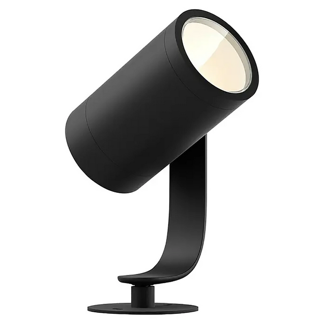 Ein moderner schwarzer Strahler mit zylindrischem Kopf, montiert auf einem geschwungenen Sockel vor weißem Hintergrund, der an das elegante Design hochwertiger Außenleuchten wie dem „Philips Hue Lily LED-Gartenspot – schwarz“ von Philips erinnert.