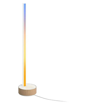 Die Philips Hue Gradient Signe Tischleuchte – weiß von Philips ist eine hohe, schlanke Tischleuchte mit LED-Beleuchtung in Gradient-Technologie und einem runden Holzsockel, die über ein sichtbares Kabel mit Strom versorgt wird und sich per Smart-Beleuchtungssteuerung bedienen lässt.