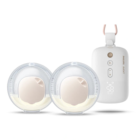 Zwei runde Philips Avent Hands-free Elektrische Doppelmilchpumpe Becher mit Milch und eine weiße Philips Steuereinheit mit Display und Tasten.