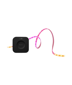 Schwarzer Smart Hub mit einem angeschlossenen Philips Hue Flux Starterkit LED-Streifen – weiß, der leuchtende Rosa-, Gelb- und Orangetöne anzeigt – perfekt für farbenfrohe Beleuchtung von Philips.