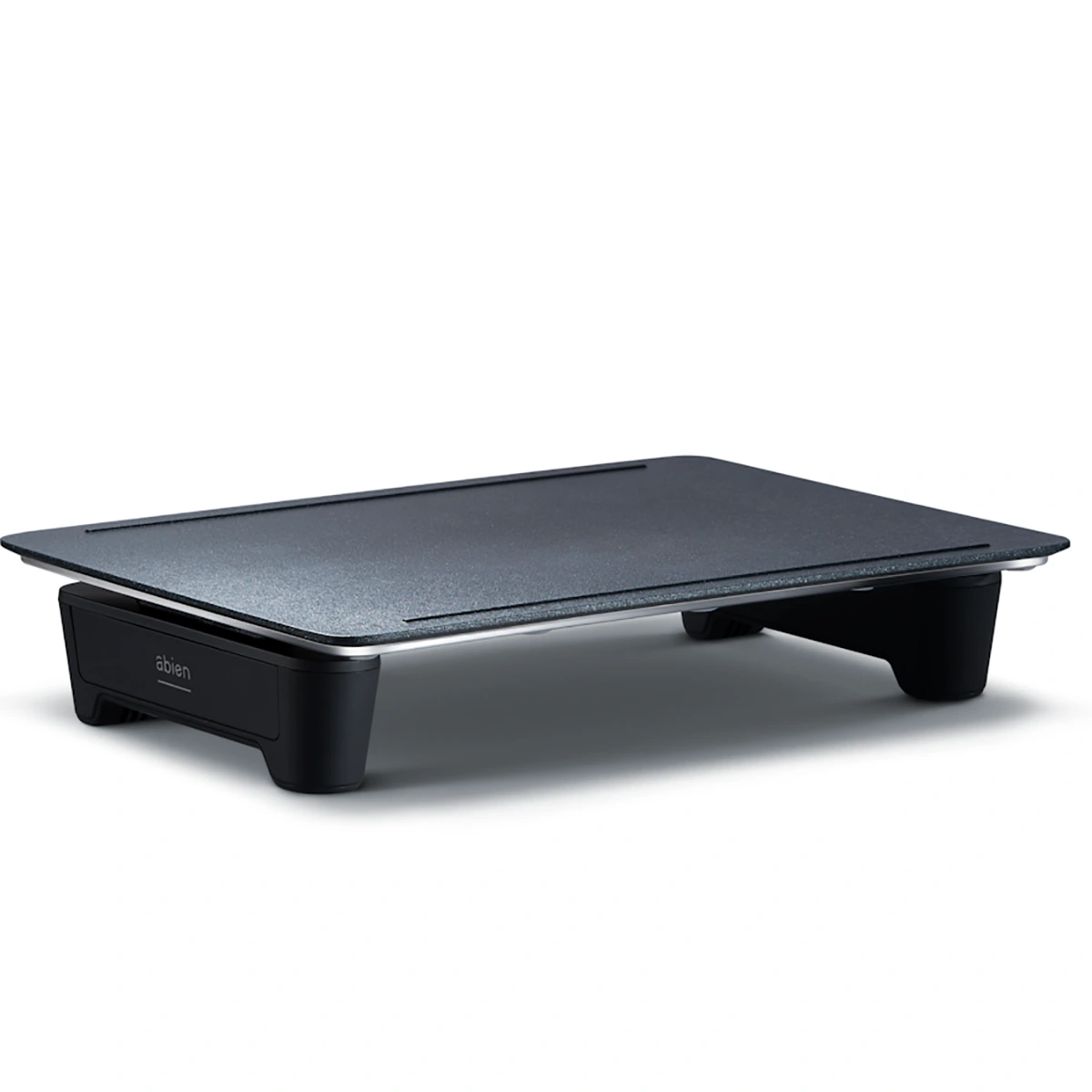 Der abien MAGIC GRILL Elektrogrill in Schwarz von abien zeichnet sich durch ein schlankes, rechteckiges Design mit kurzen Beinen und flacher Oberfläche aus, inspiriert von japanischer Esskultur - ideal als moderner Magic Grill oder Teppanyaki-Platte.