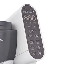 Nahaufnahme des Bedienfelds des Babymoov Nutribaby Plus - Industrial Grey, mit digitalen Zahlen und mehreren Funktionstasten, die die Vielseitigkeit dieses multifunktionalen Dampfgarers von Babymoov zeigen.