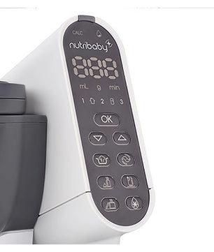 Nahaufnahme des Bedienfelds des Babymoov Nutribaby Plus - Industrial Grey, mit digitalen Zahlen und mehreren Funktionstasten, die die Vielseitigkeit dieses multifunktionalen Dampfgarers von Babymoov zeigen.