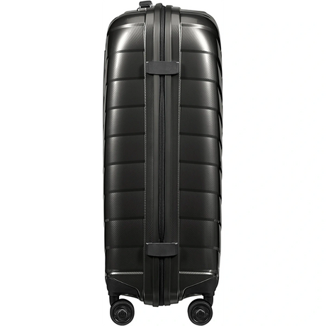 Ein grauer Samsonite Attrix Hartschalenkoffer 69 cm aus robustem Roxkin Material steht aufrecht auf vier Rollen, von der Seite betrachtet.
