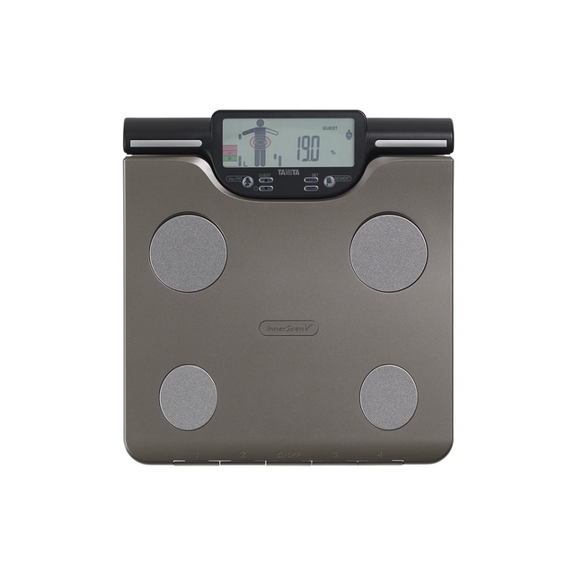 Die TANITA BC-601 Segmentale Körperanalysewaage ist eine dunkelgraue Digitalwaage mit vier Metall-Sensor-Pads, LCD-Display, SD-Kartenfunktion und detaillierter Gewichts- und Körperanalyse, die den Markennamen TANITA trägt.