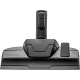 Der THOMAS Cycloon Hybrid Pet & Friends in Orange verfügt über eine rechteckige Bodendüse mit beschrifteten Tasten und einem Saugrohranschluss, der mit dem HEPA-13-Filtersystem für eine effiziente Reinigung kompatibel ist.